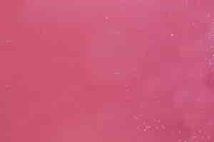 Free photo foam flakes on pink water