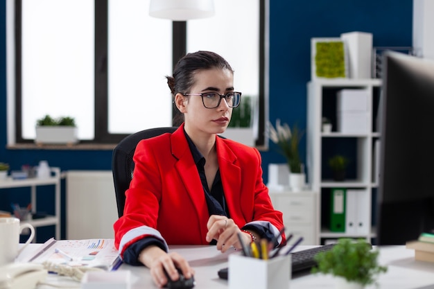 Focused businesswoman in corporate office workplace