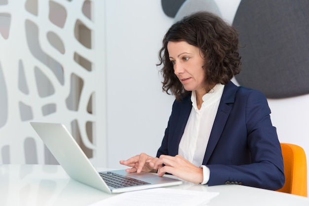 Focused businesswoman working on computer