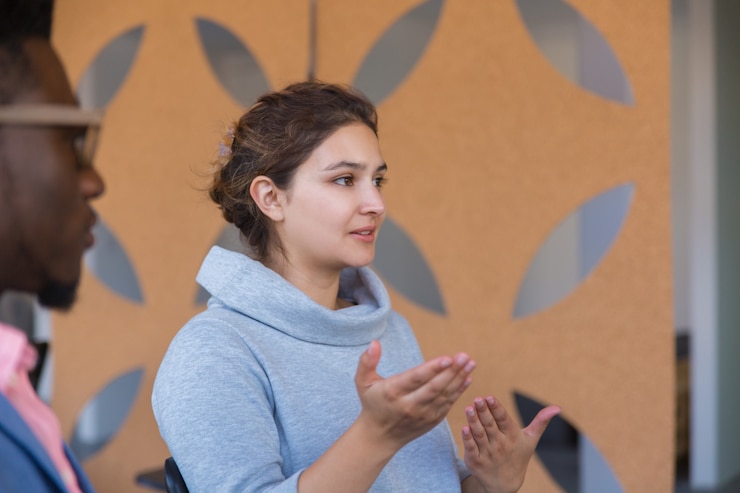 Free Photo focused excited female entrepreneur explaining startup details