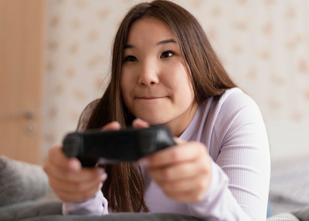 Focused girl playing videogames