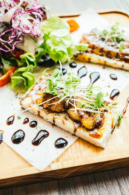 Foie gras on top of bread with sauce