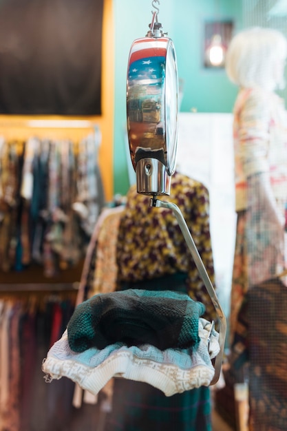 Folded clothes on the scales at clothing shop