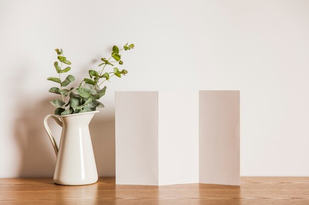 Folded paper next to plant