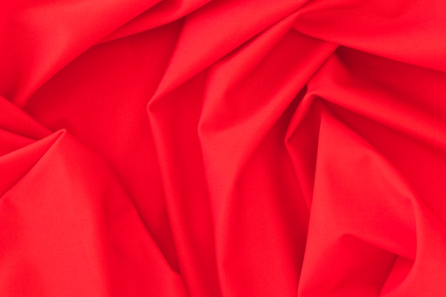 Free photo folded red textile fabric texture background