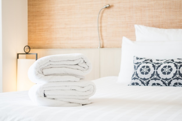 Folded towels on a bed