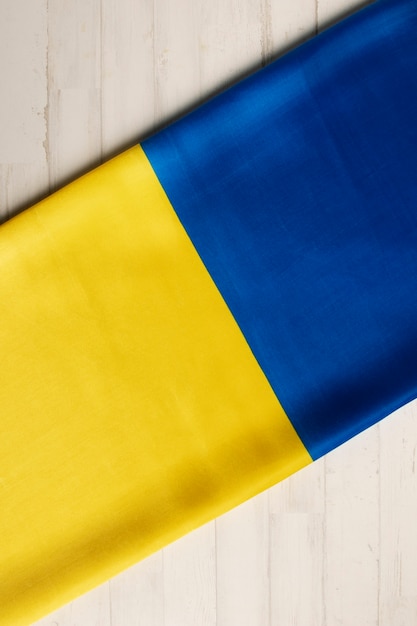 Folded ukranian flag still life flat lay