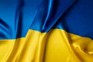 Free photo folded ukranian flag still life top view