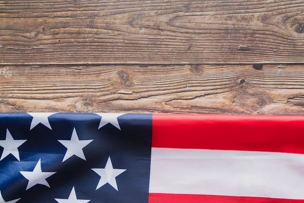 Folded United States flag on timber