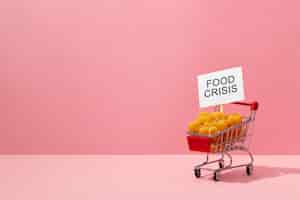 Free photo food crisis concept with shopping cart