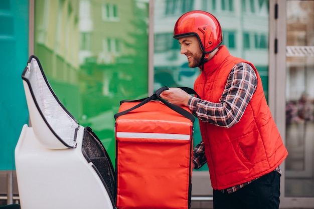 Food delivery boy delivering food on scooter