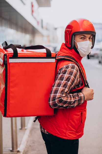 Free photo food delivery man with boxes with food