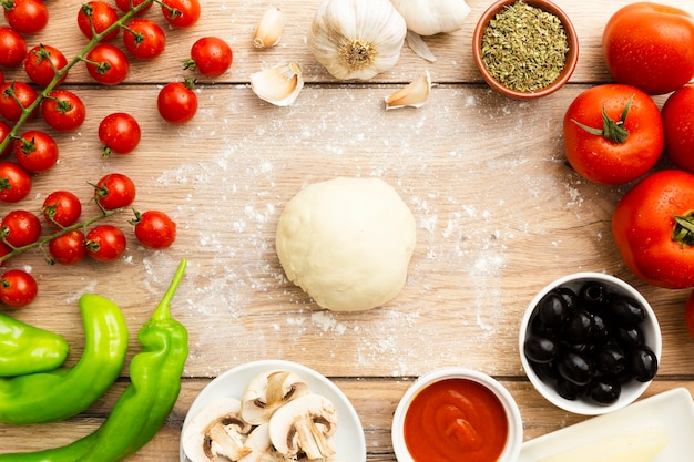 Food frame with dough and tomatoes