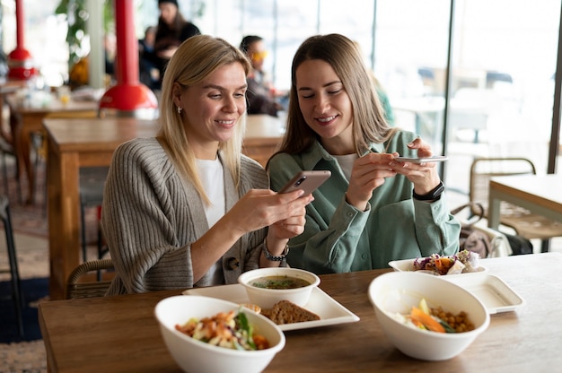 Food lovers taking photo of their meals