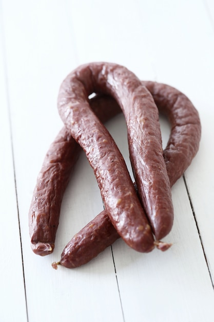 Food, meat. Delicious sausage on the table