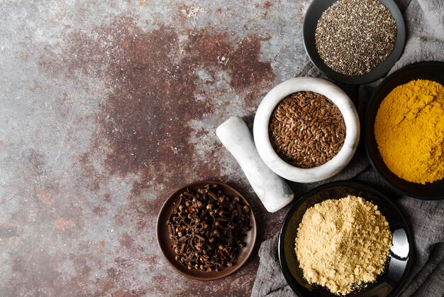 Food powder and seeds in bowls copy space