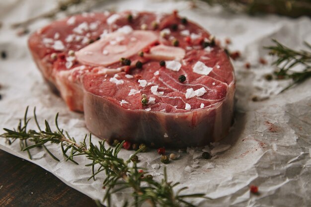 Food set, romero, raw meat steak, salt, pepper, garlic, olive oil,fork