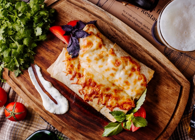 Food with roasted and melted cheese on the top.