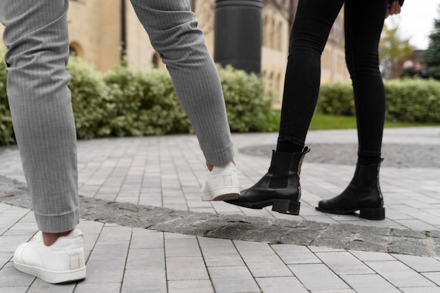 Free photo foot bump alternative greetings outdoors