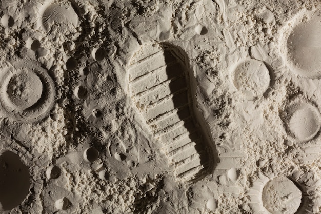 Детали шага ноги концепции текстуры луны