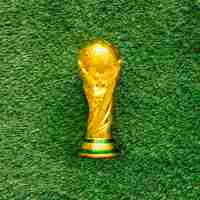 Free photo football background on grass with trophy