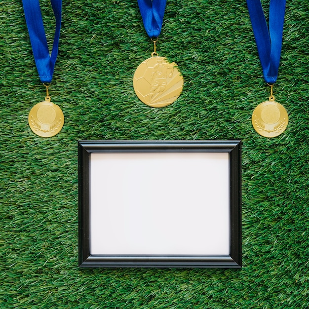 Free photo football background with frame below medals