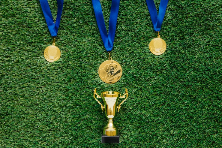Free Photo football background with medals and trophy