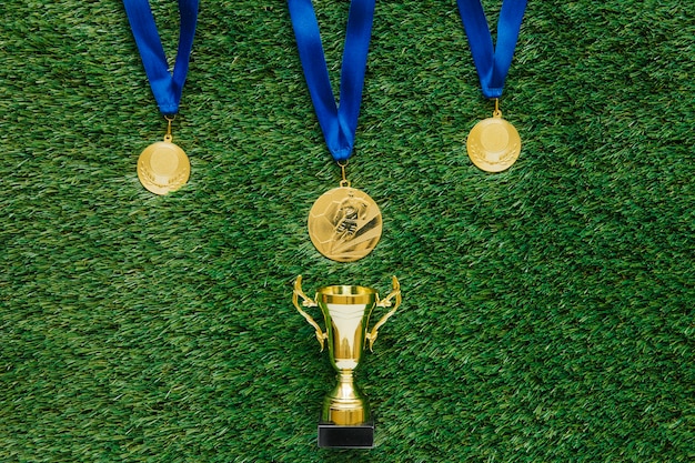 Football background with medals and trophy