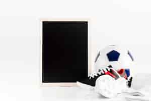 Free photo football composition with leaning slate