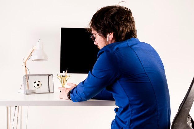 Football fan at desk