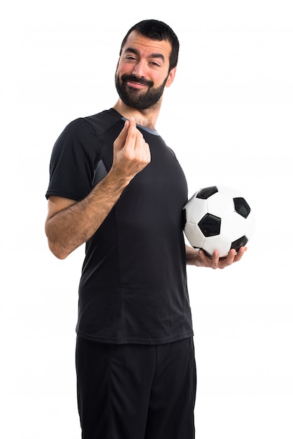 Free photo football player doing a money gesture