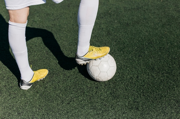 Free photo football player legs with shadows