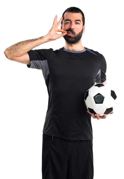 Football player making silence gesture