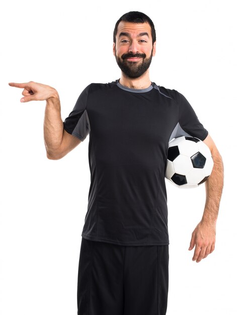 Football player pointing to the lateral