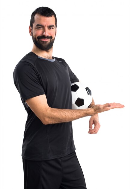 Football player presenting something