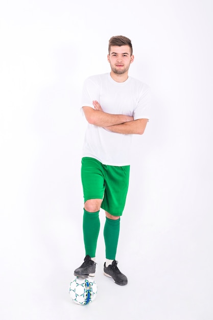 Free photo football player with arms crossed