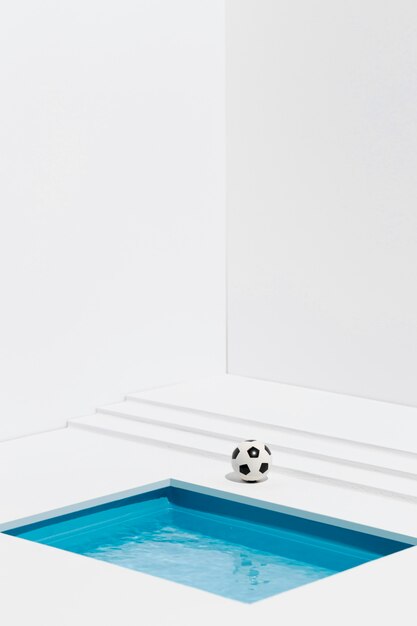 Football next to small swimming pool