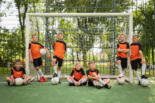 Free photo football trainer teaching his pupils