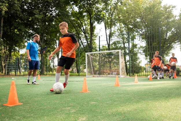 Football trainer teaching his pupils