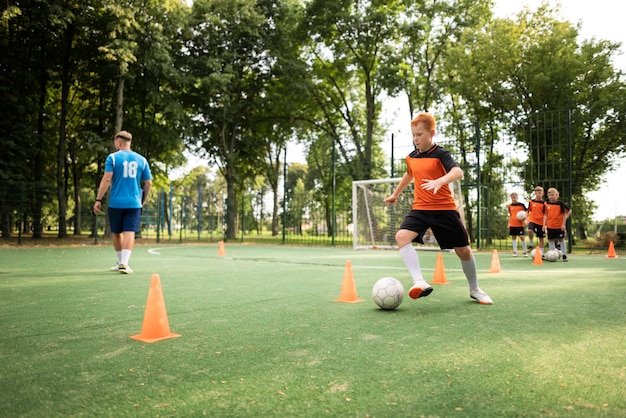 Football trainer teaching his pupils