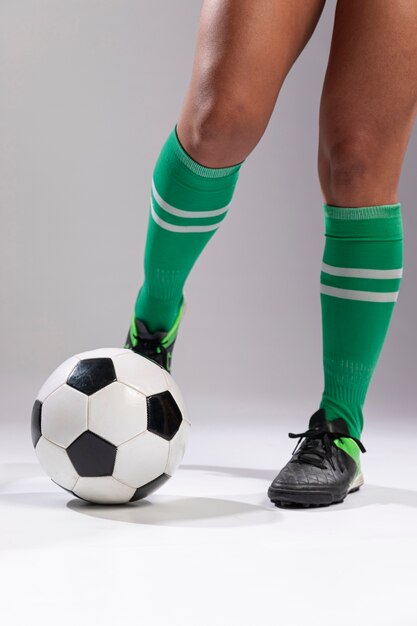 Footballer kicking soccer ball