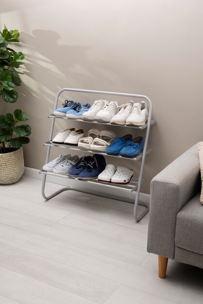 footwear stacked in shoe rack indoors