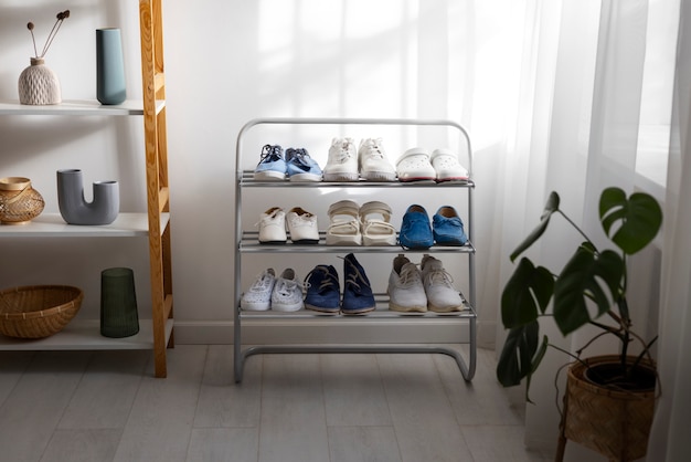 footwear stacked in shoe rack indoors