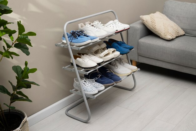 footwear stacked in shoe rack indoors