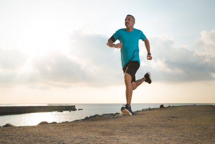 Free Photo forceful young man enjoying running outdoors
