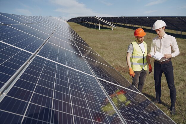 Foreman and businessman at solar energy station.