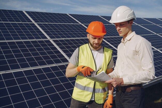 Foreman and businessman at solar energy station.