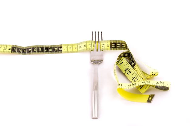 Fork and centimeter tape, slimming concept