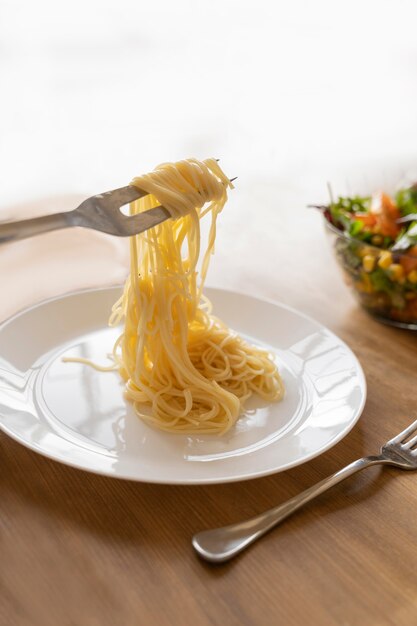Fork holding delicious pasta
