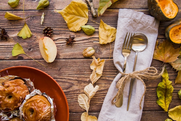 Fork and spoon with baked apples